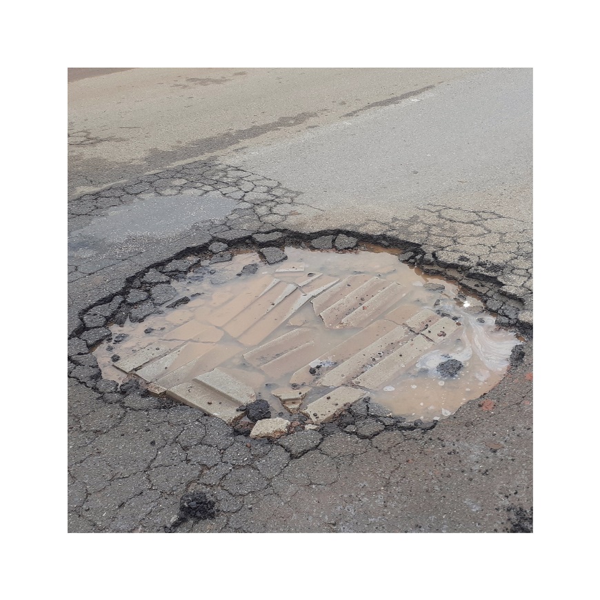A massive pothole filled with prefabricated slabs of concrete.