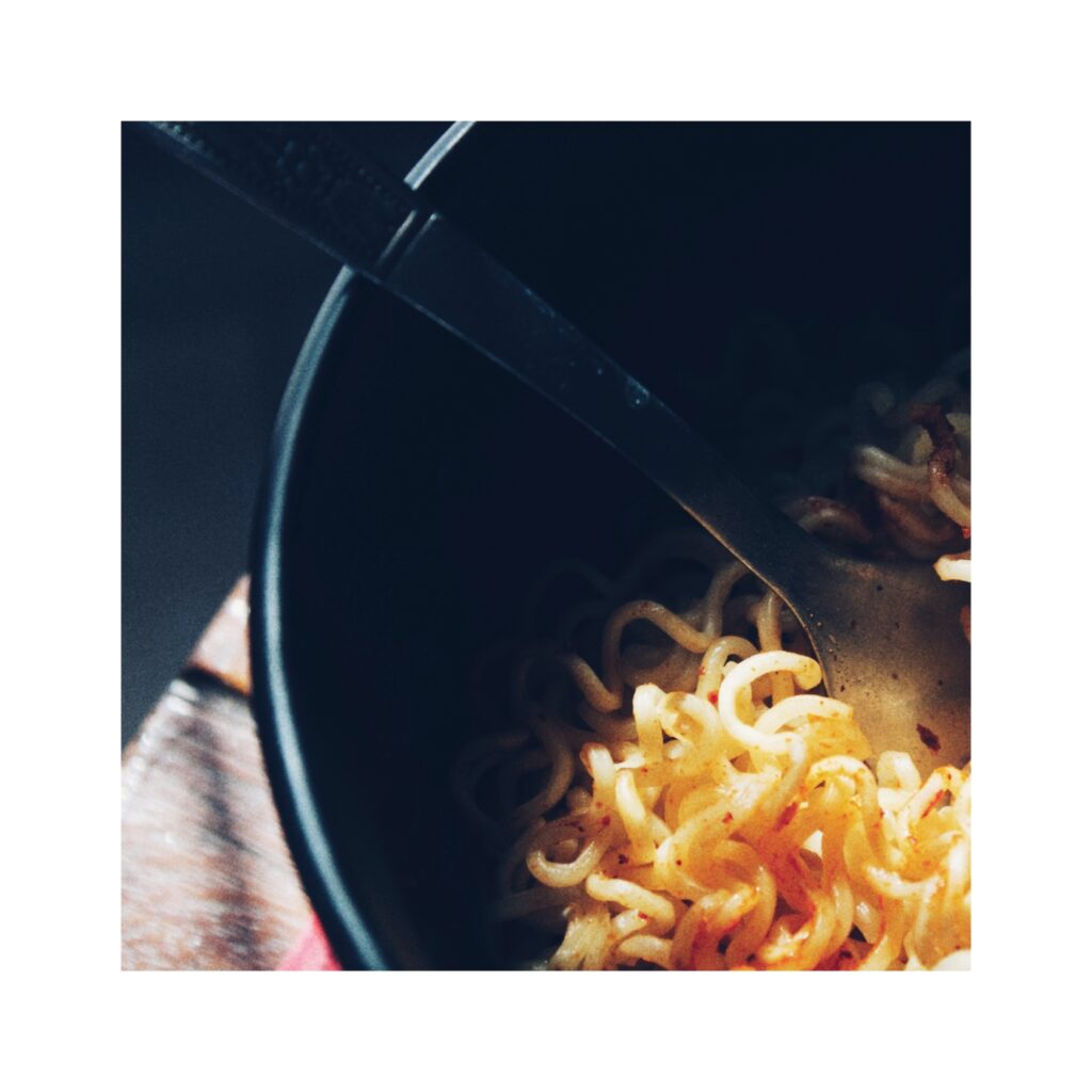 A close up photo of a bowl of instant noodles.
