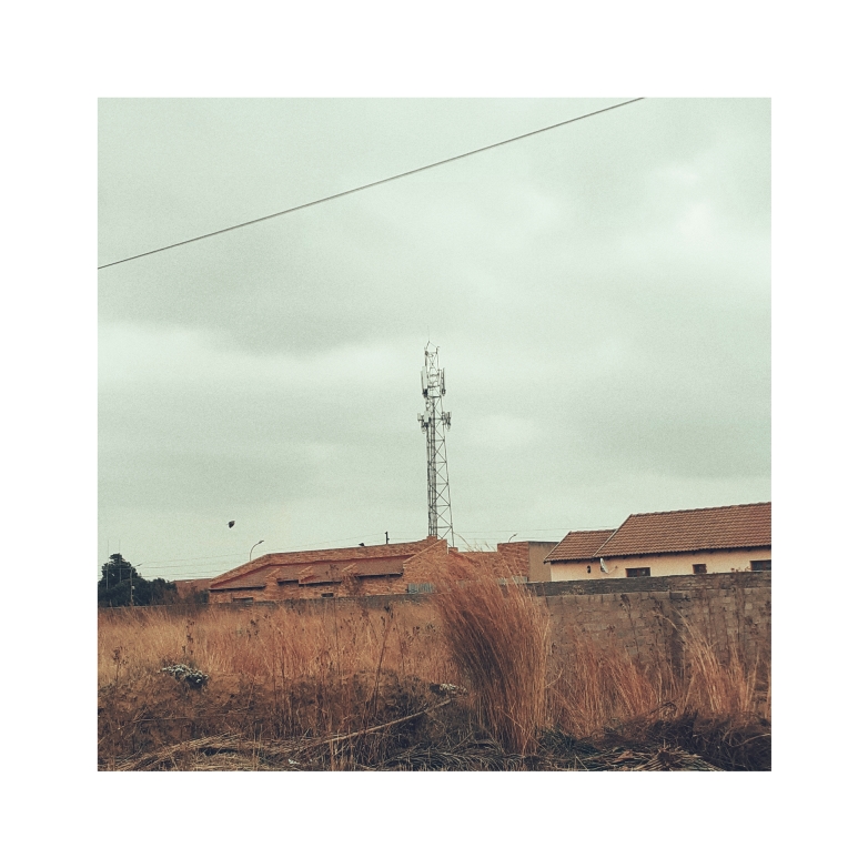An overcast sky as backdrop against a telecoms tower.