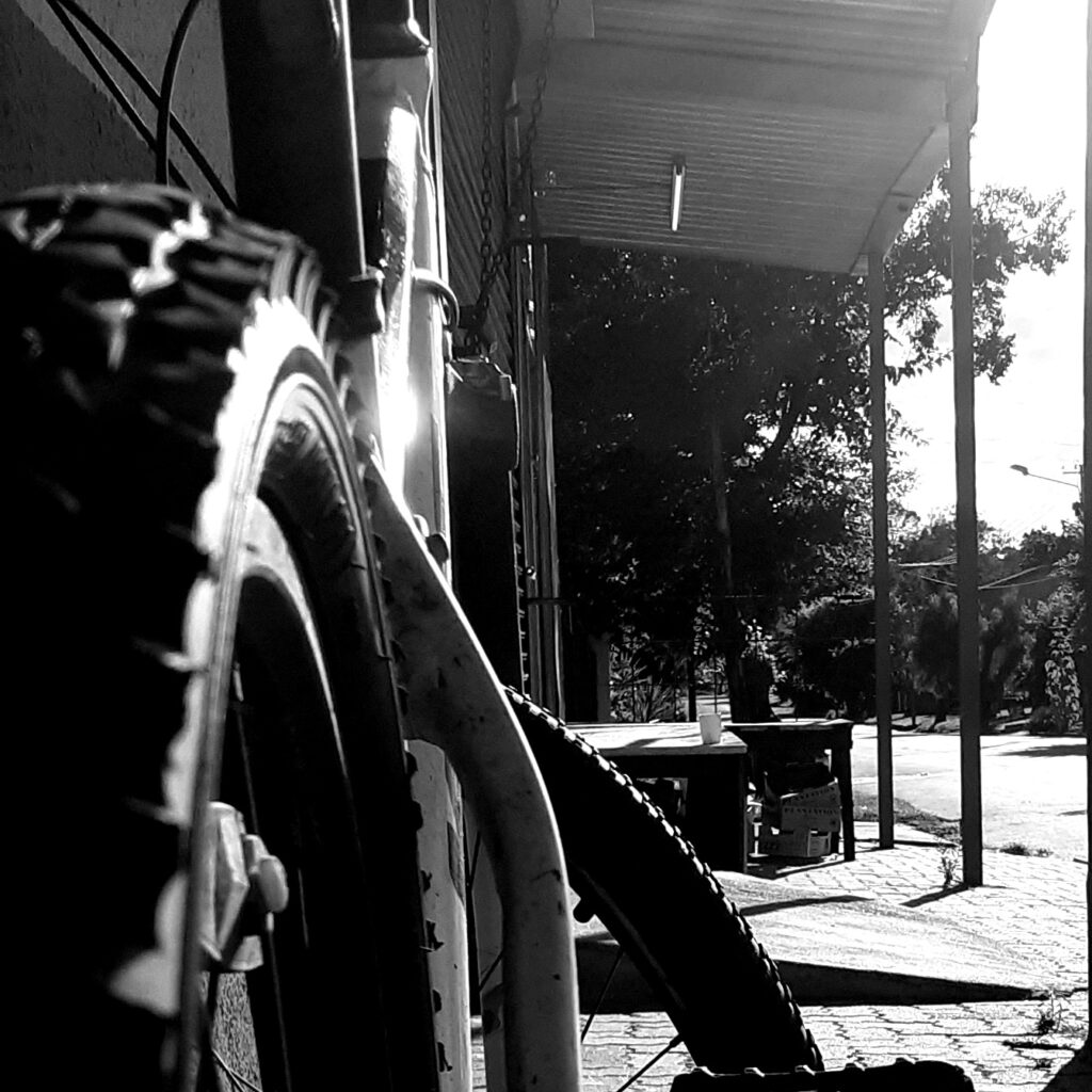 An empty cup standing outside a closed business.
