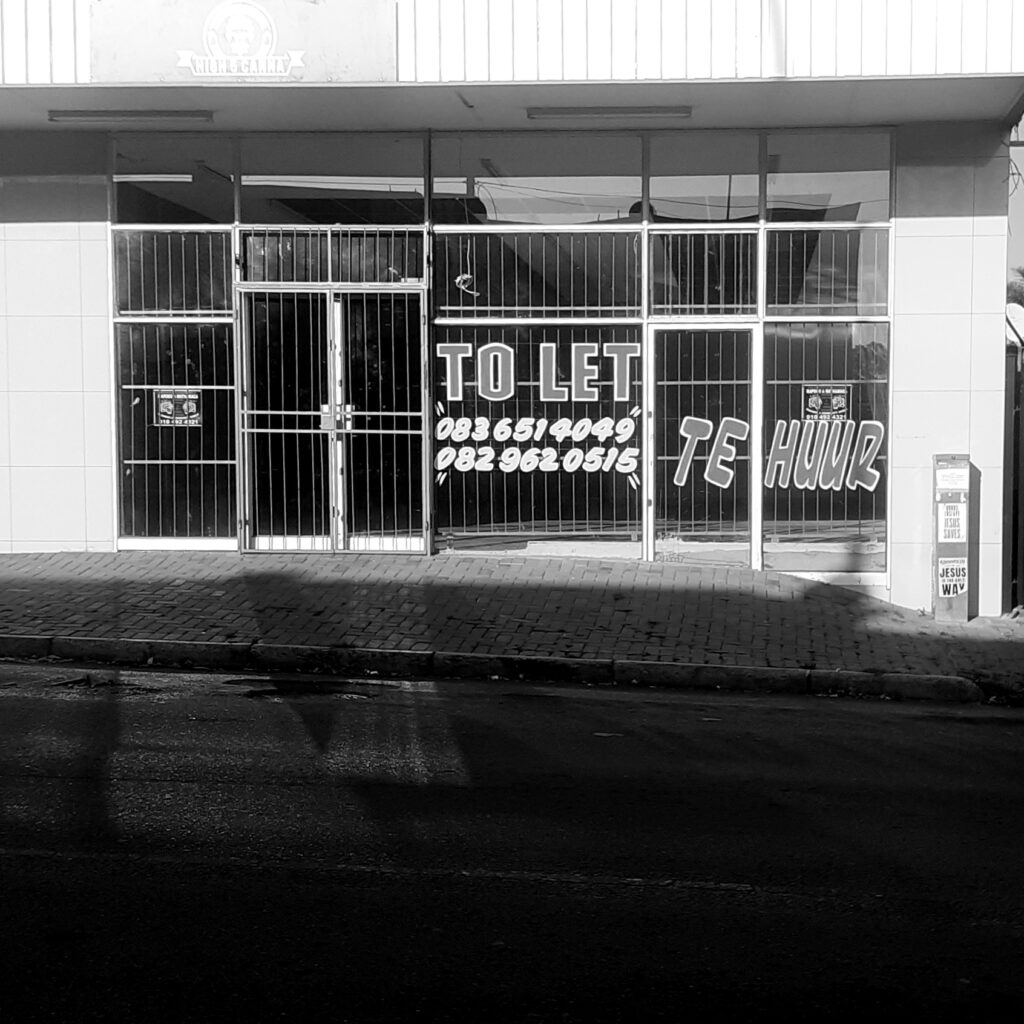 Store front with signage on the window.
