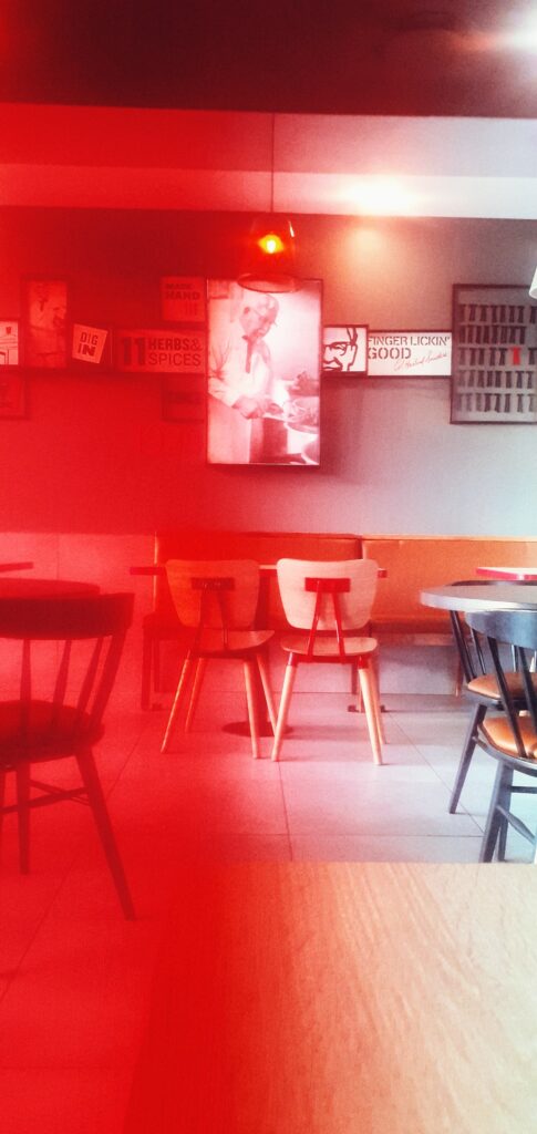An image of a table and chairs within a fast food restaurant in the West of Gauteng.