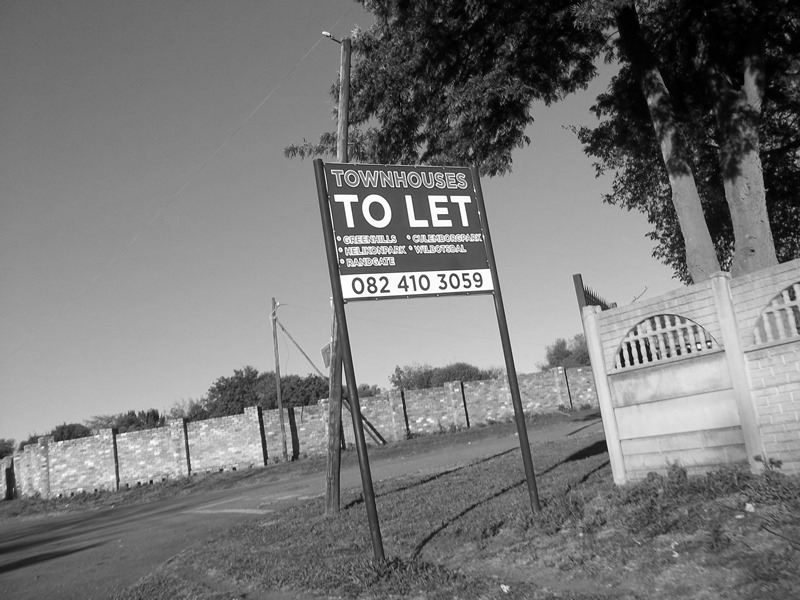 Townhouses to let sign.