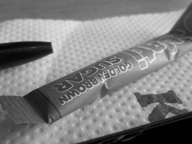Close up of a sachet of sugar.