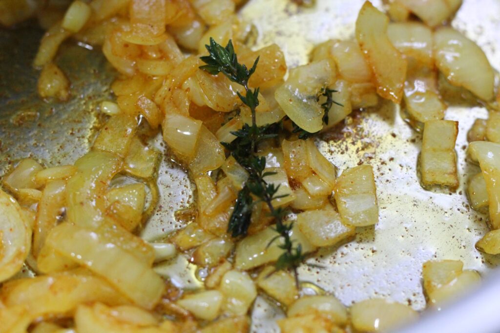 Friend onions and a sprig of thyme.