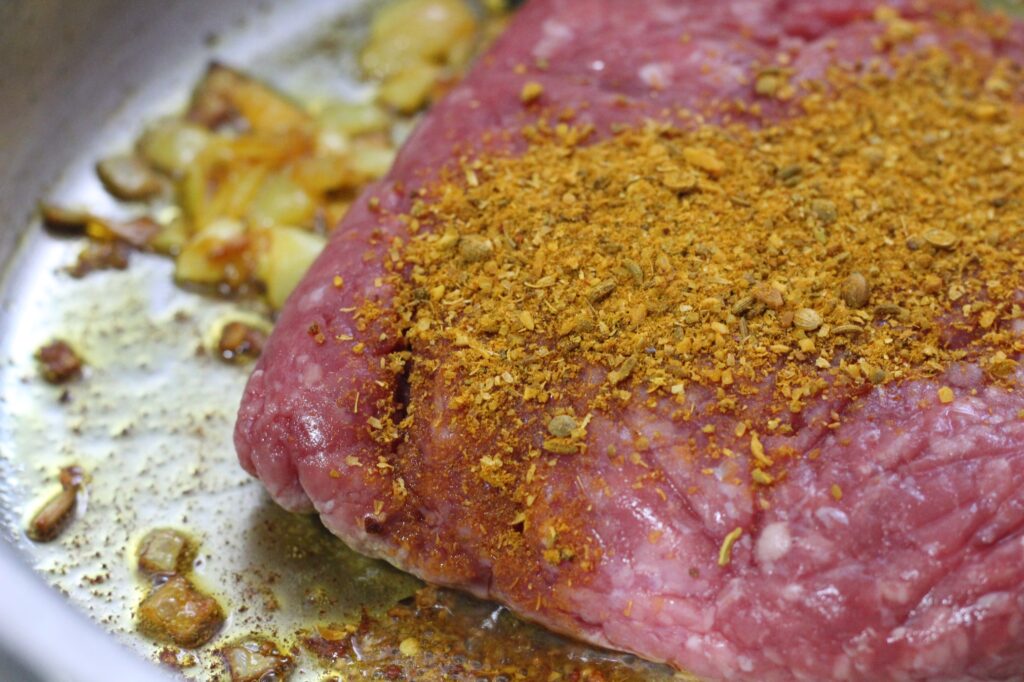 Ground beef covered with Cape Malay Curry spice.